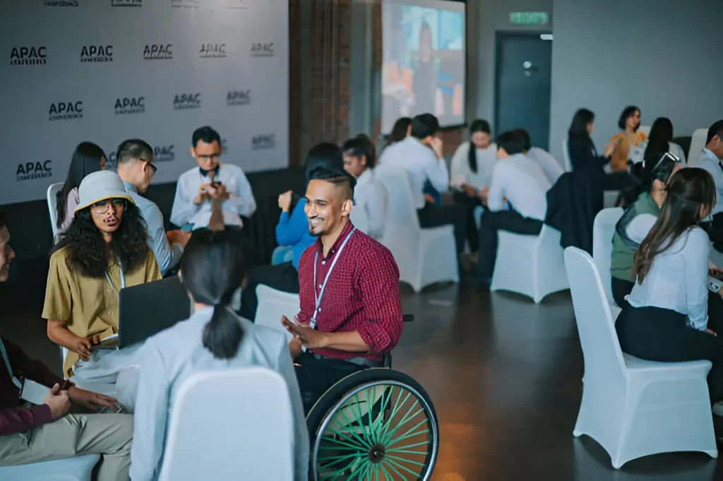 A happy wheelchair user attending a social event