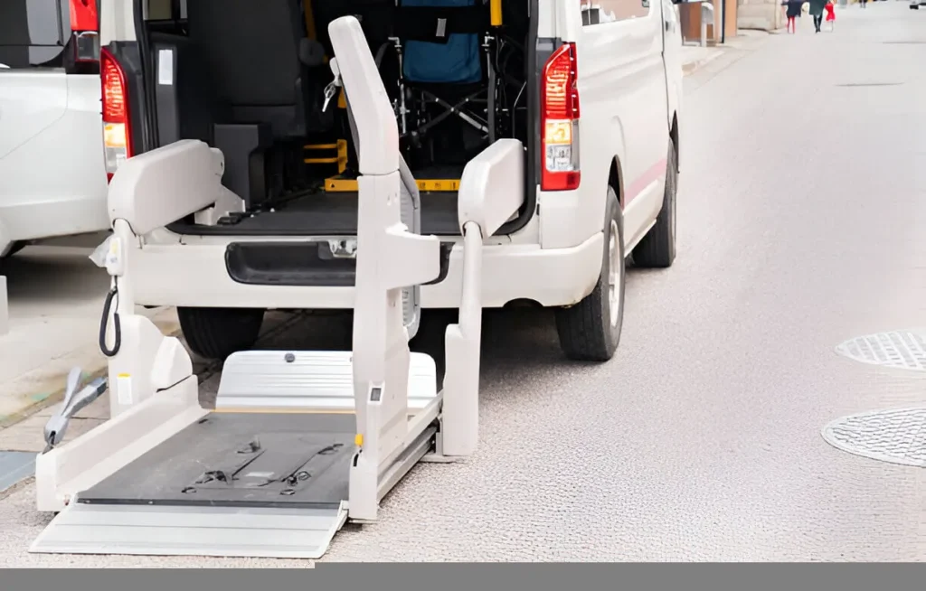 Professional disabled taxi with hydraulic ramp at hospital entrance.