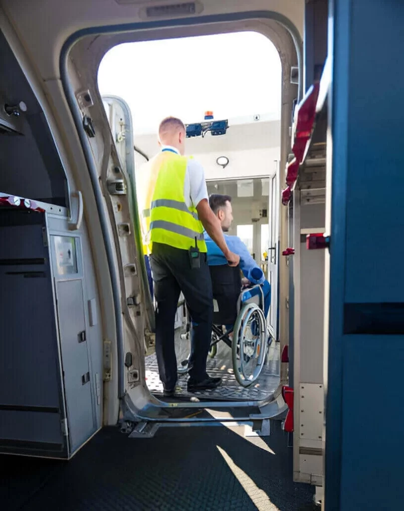 Wheelchair passenger boarding accessible vehicle at JFK Airport in NYC