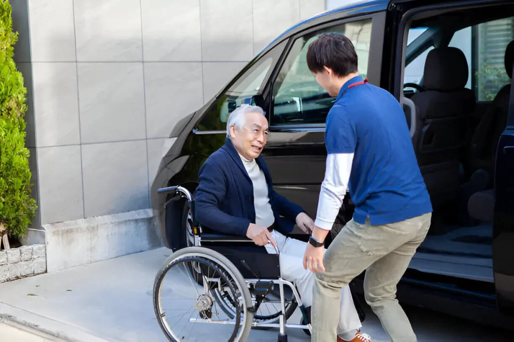 Accessible wheelchair taxi driver helping passenger in NYC