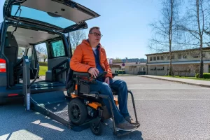Professional NYC wheelchair transportation van helping a passenger