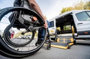 affordable wheelchair taxi van parked in Manhattan with open ramp, ready for rider